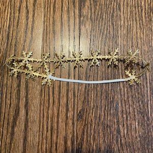 Gold Snowflake headband for baby, used for 1st birthday
